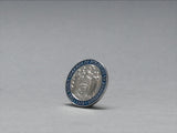Silver pin badge